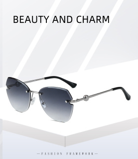 S33502新款无框太阳镜女时尚切边墨镜防紫外线不规则街拍眼镜批发